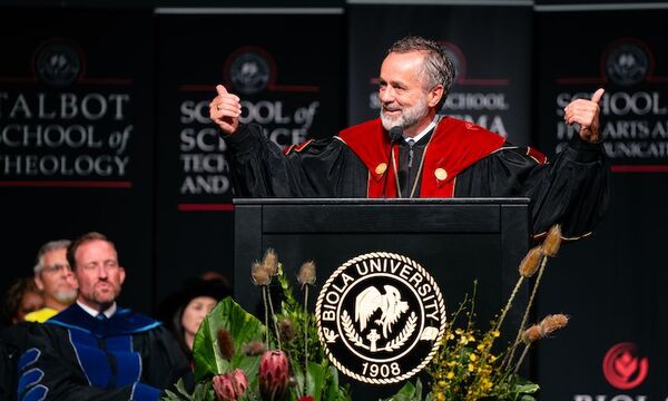 Image shows Dr. Barry H. Corey speaking at Convocation