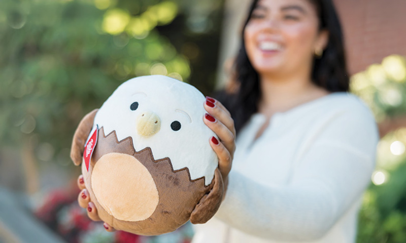 student holding SquishEagle