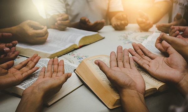 stock image of multiple hands in a circle