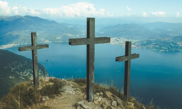 image shows three crosses on a hill