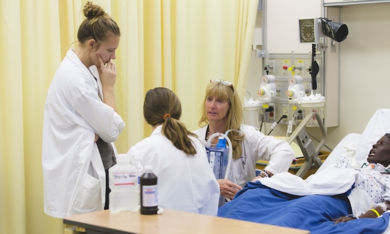 Image shows nursing students and professor