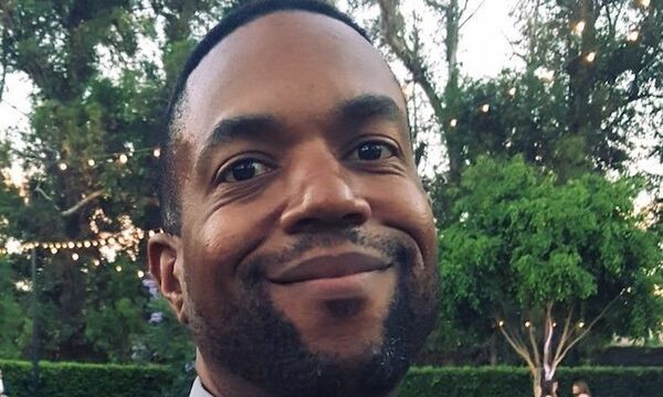Image shows La Shawn Rivers smiling at the camera