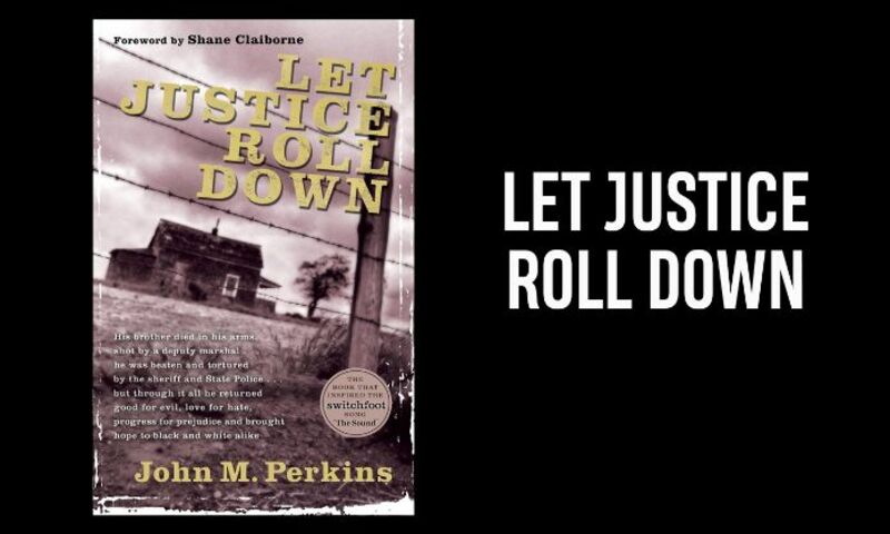 Photo shows copy of John Perkins book Let Justice Roll Down