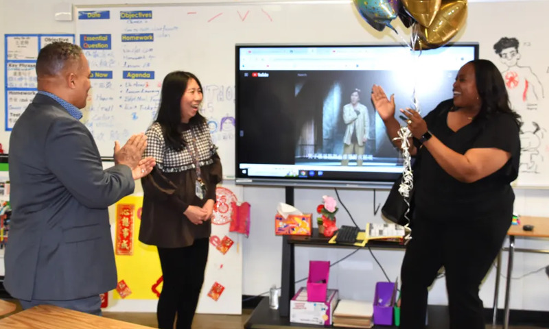 Teacher getting the surprise news in her classroom that she received the award.