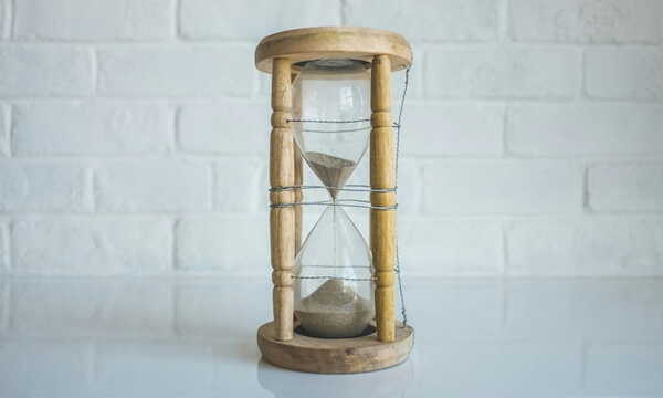 Clear hourglass with brown frame