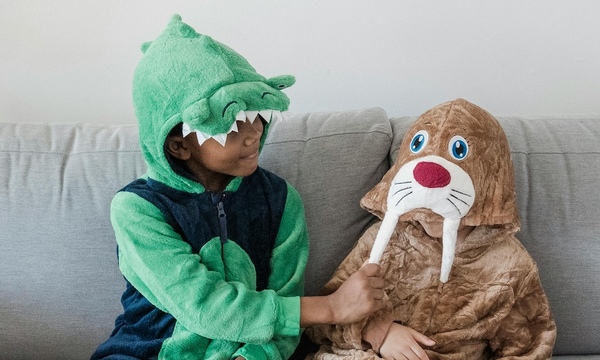 image shows two children in Halloween costumes