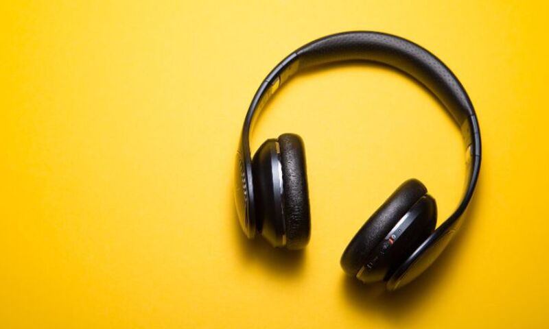 Image shows headphones on yellow background