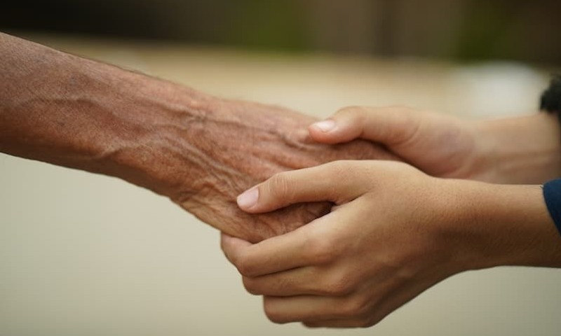 two people holding hands