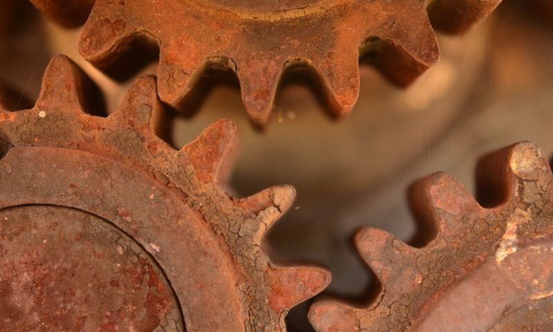 Close-up image of three cog wheels working together