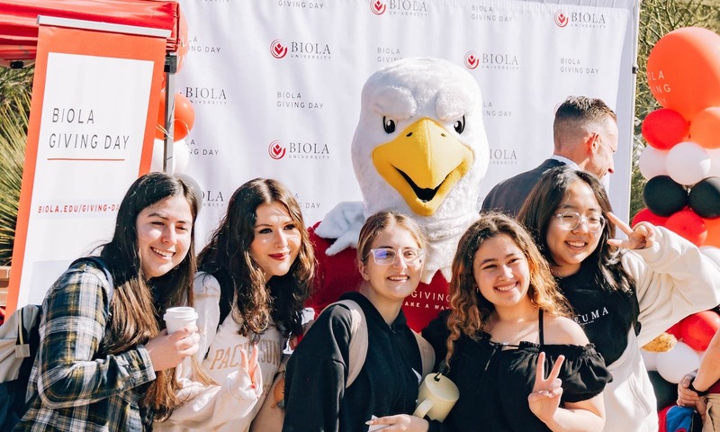 Image shows students with Eddie the Eagle