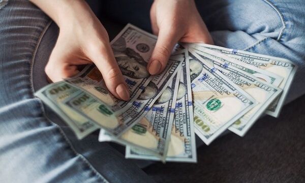 guy holding lots of money