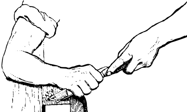 image shows hand holding a chisel 