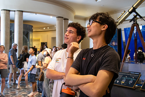 student holding an open book