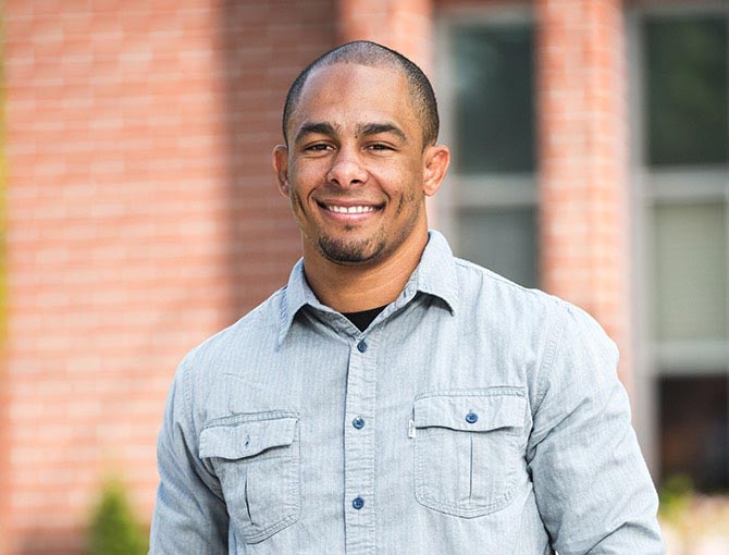 A male student smiles