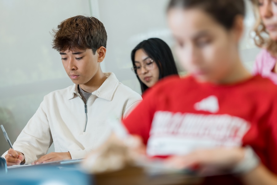 Students in a classroom doing work.