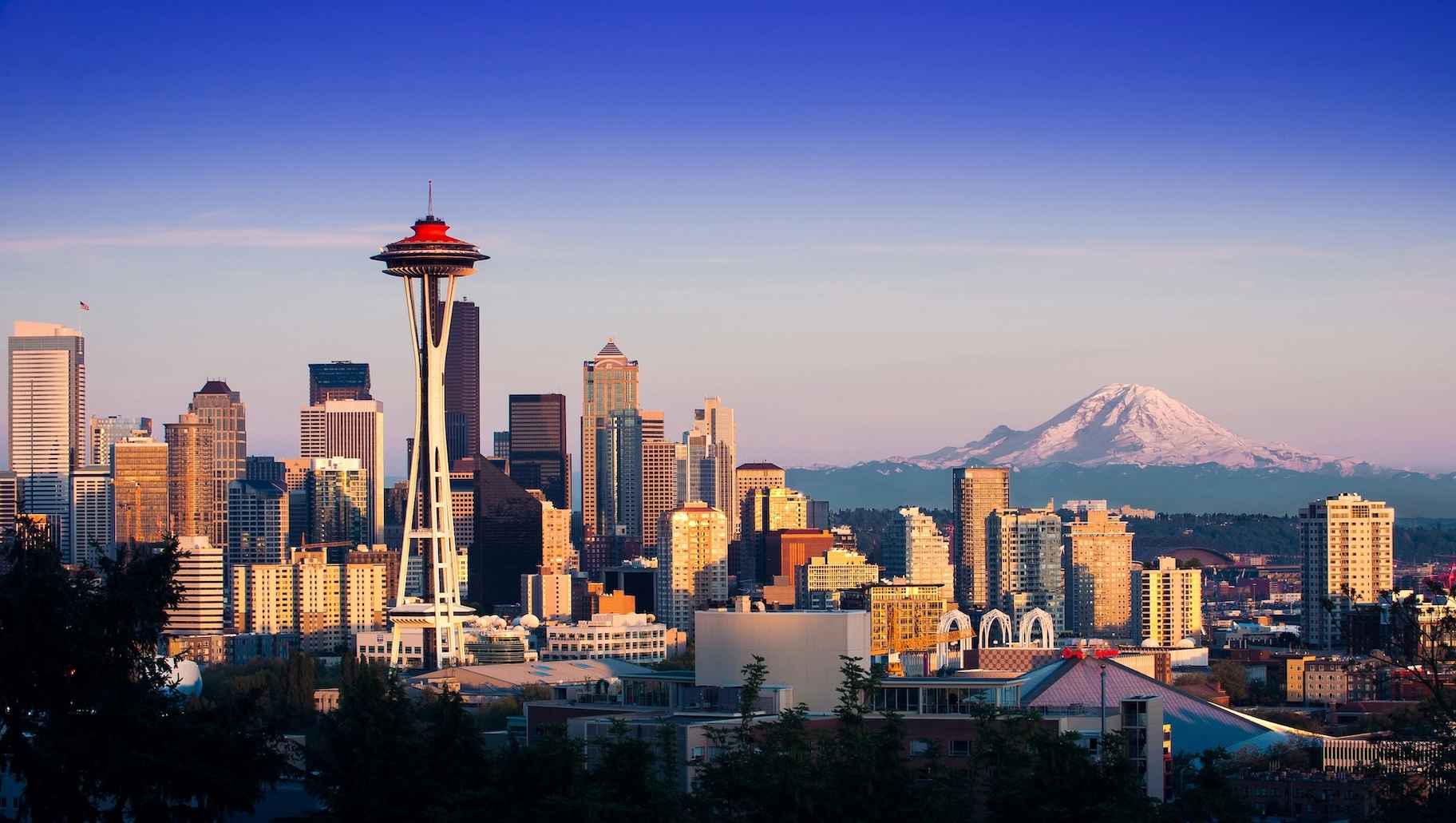 Downtown Seattle skyline with the Space Needle and Mount Rainier in the background.
