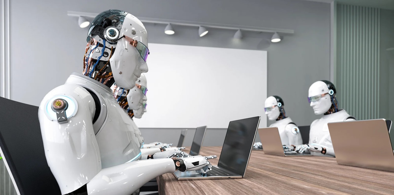 Humanoid robots sitting at a conference table having a meeting.