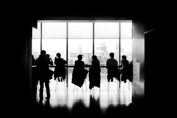 silhouettes in meeting room