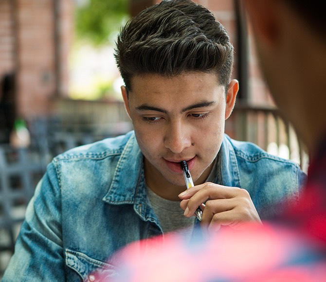 A student studies while at the cafeteria.