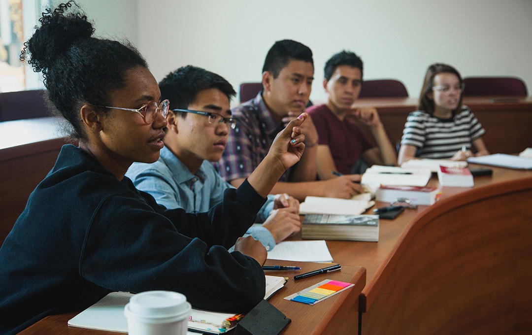 A student asks a question in class.
