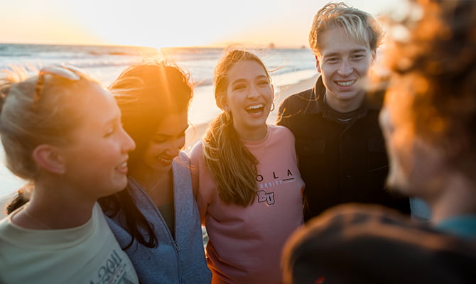 Students together on a beach