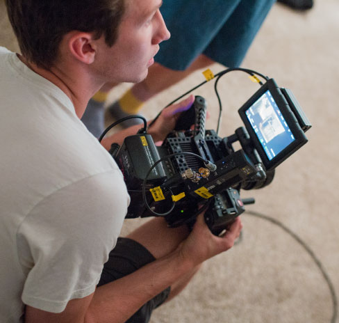 Film student holding a camera