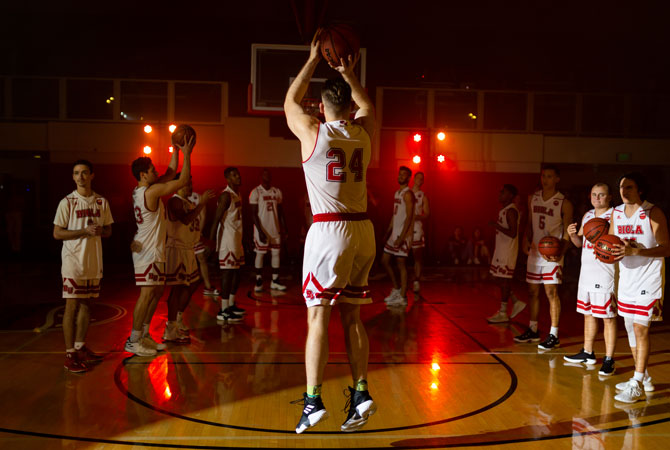 Biola Granted Full Membership in NCAA Division II Athletics, photo of Biola basketball team playing in Chase Gymnasium