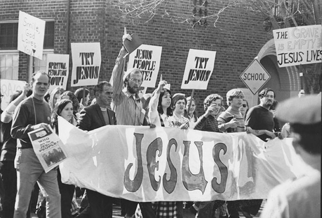 Crowd with Jesus sign
