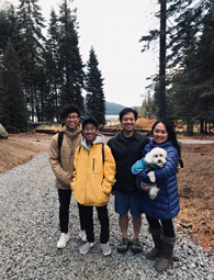 four students standing together