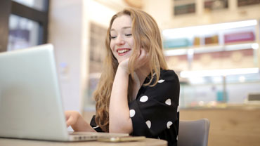 Woman in dress on computer