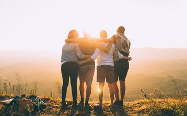 four friends hugging