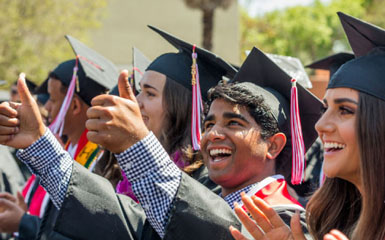 graduates smiling