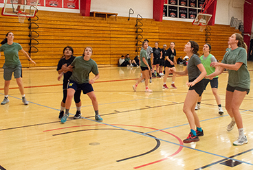 Students playing an intramural basketball game