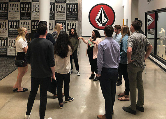 a group of students touring an office