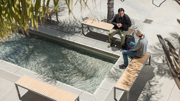 two students in feinberg building courtyard