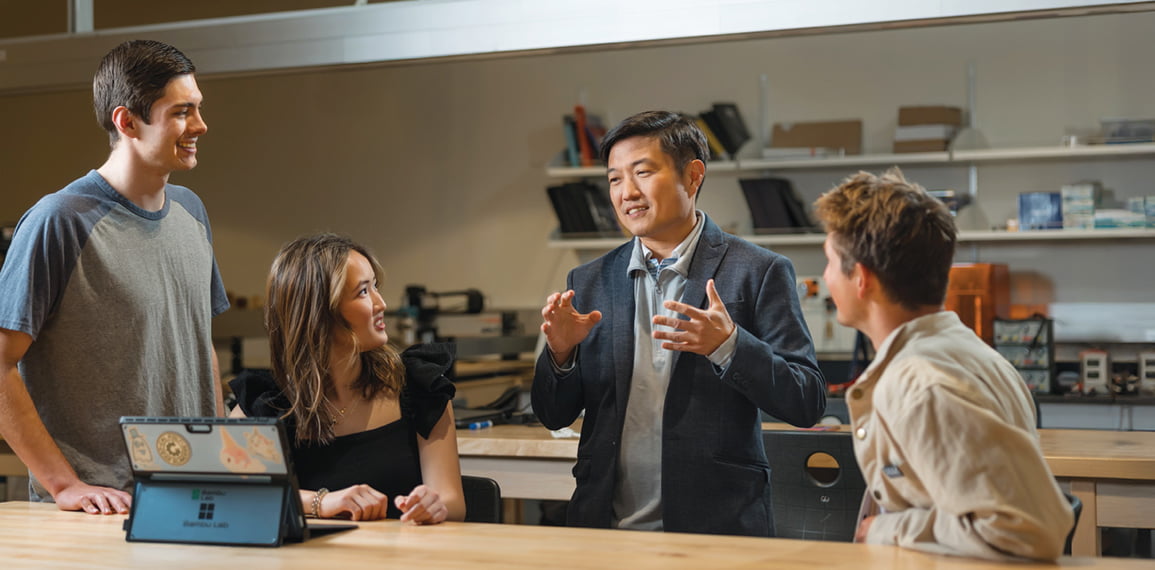 students talking with a professor