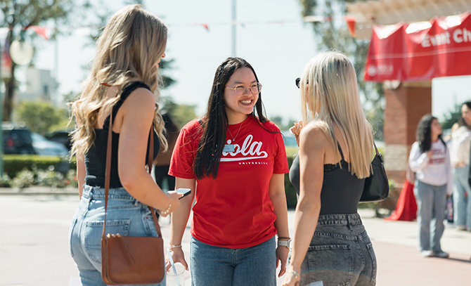 student ambassador greeting prospective students