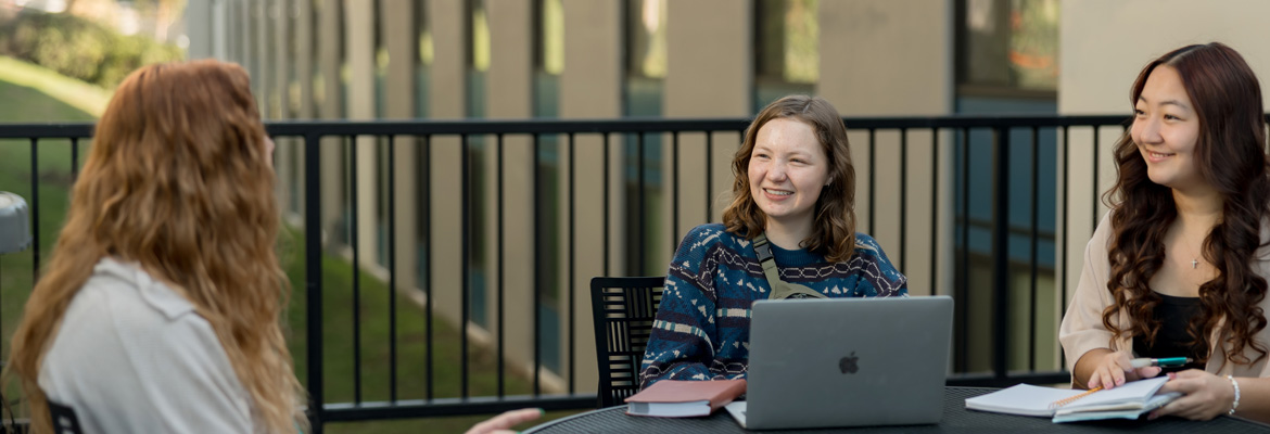 Students studying on the Sigma patio