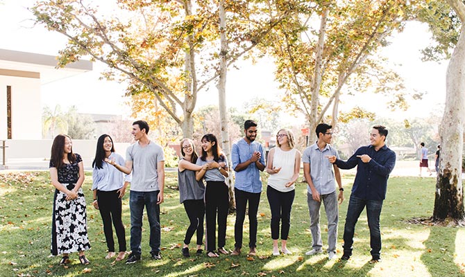 A group of students smiling outside