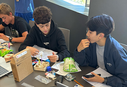 two high school students participating in lesson