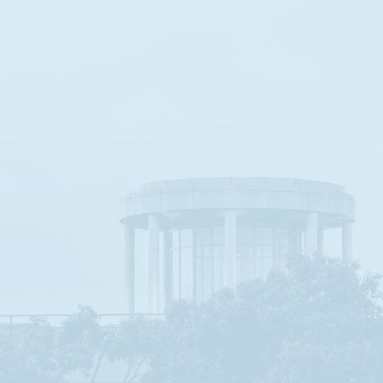 a blue tinted photo of the library beacon