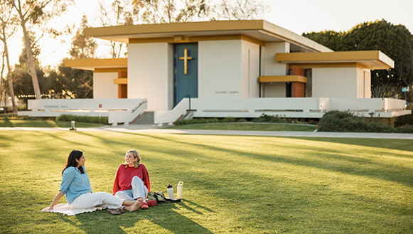 two students sitting in front of calvary chapel