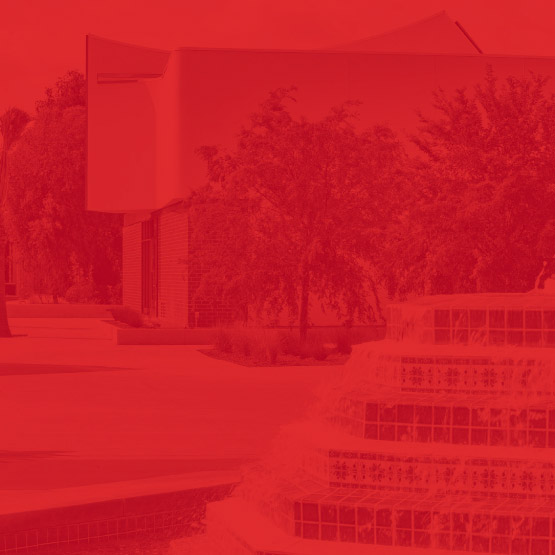 a red tinted photo of a fountain