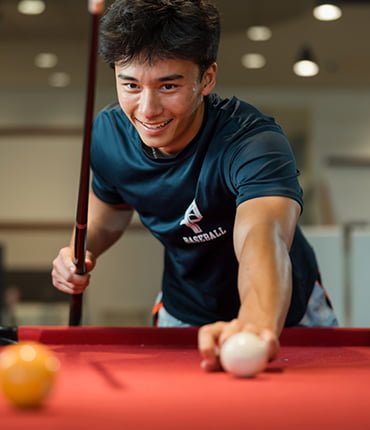 Student playing pool