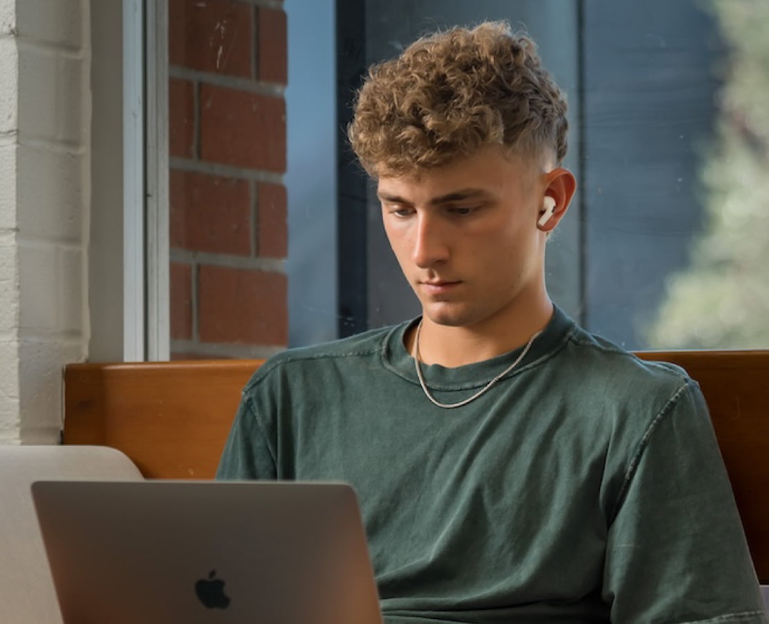 young man using a laptop