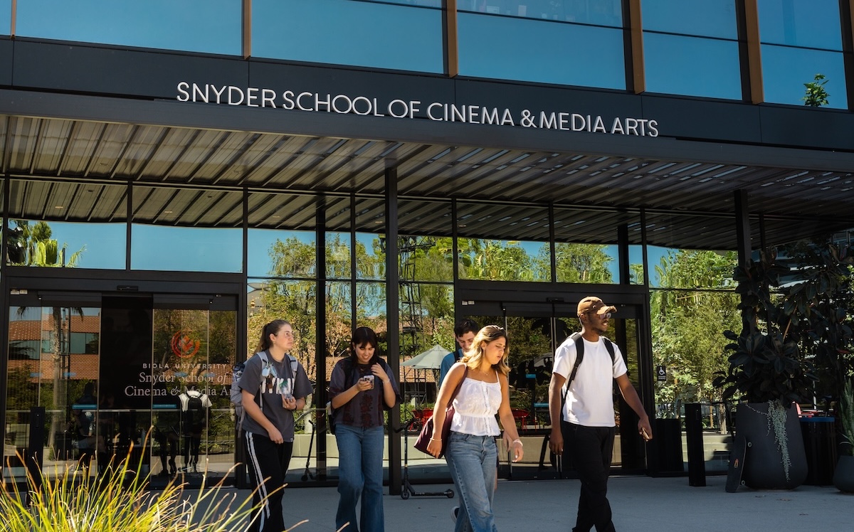 Students walking out of the new School of Cinema and Media Arts building
