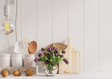 Cutting board, flowers and kitchen tools