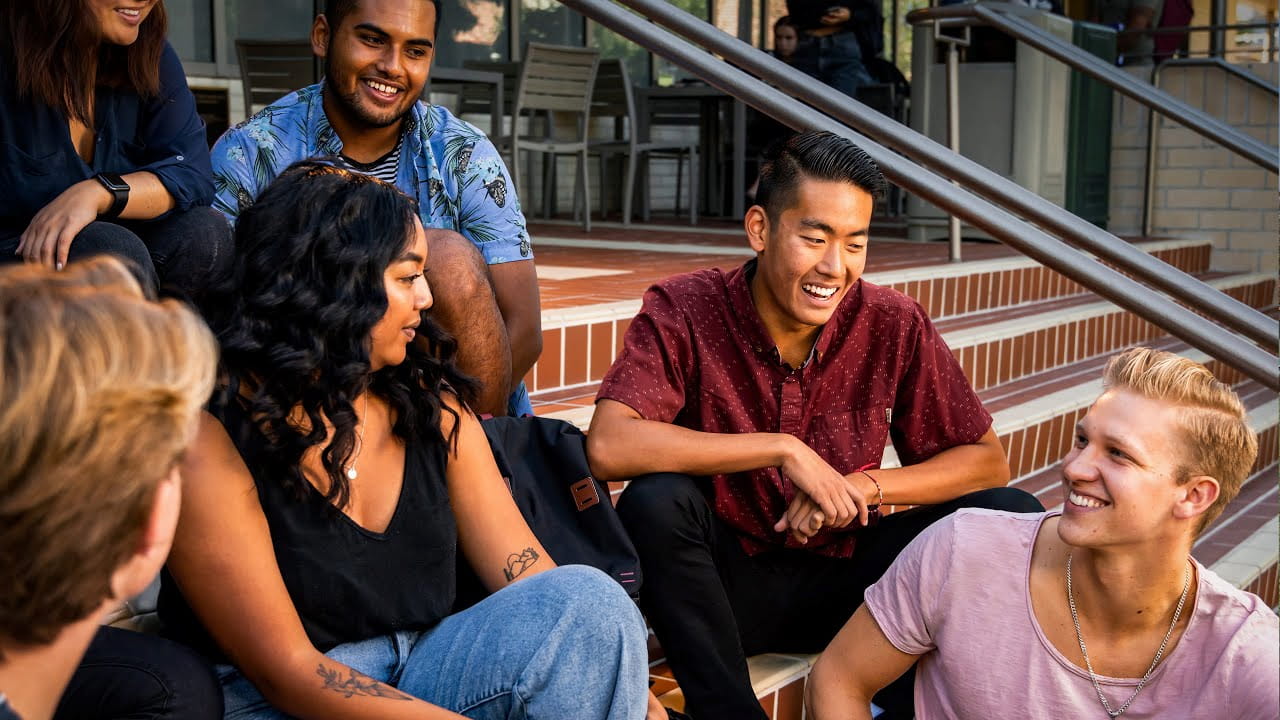 A group of students smiling outside