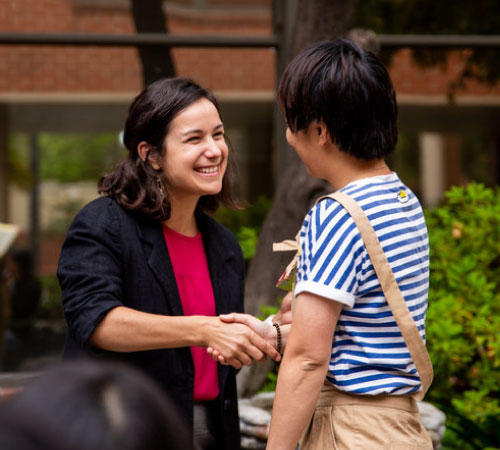 professor shaking a students hand