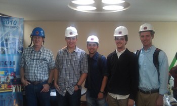 five men in hard hats